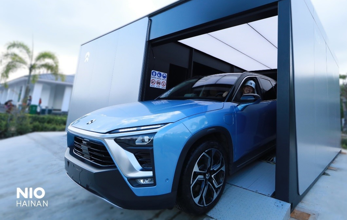 nio electric vehicles EV china tesla battery swap charging infrastructure